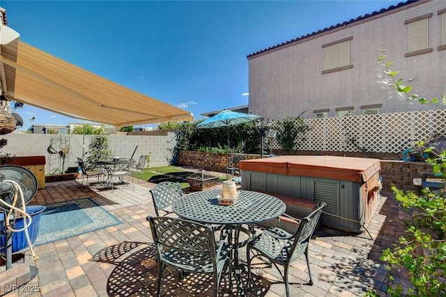 view of patio with a hot tub