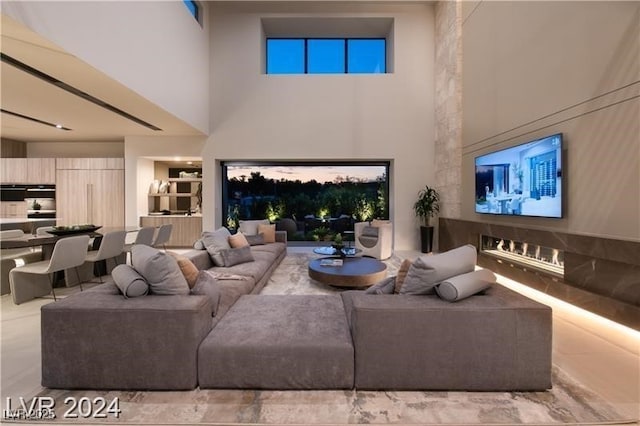 living room with a towering ceiling