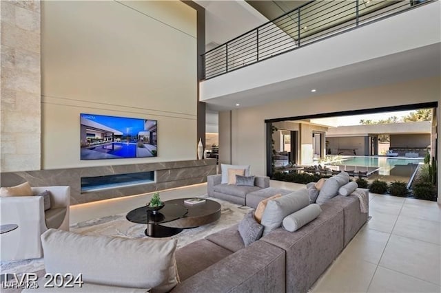 living room with a towering ceiling