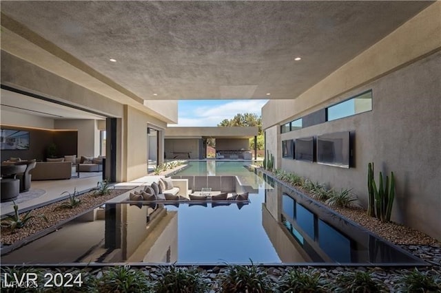 view of swimming pool featuring an outdoor living space