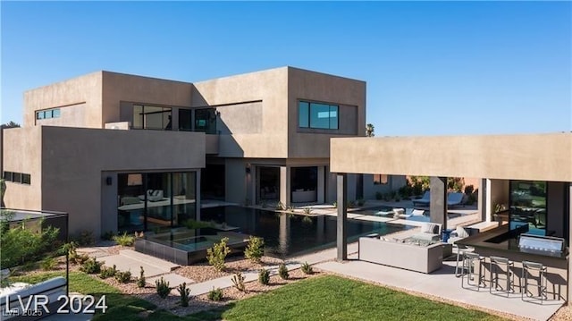 back of house with a patio area