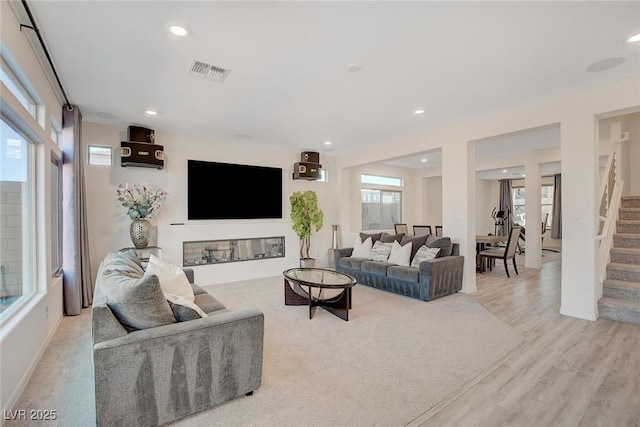 living room featuring light hardwood / wood-style floors and plenty of natural light