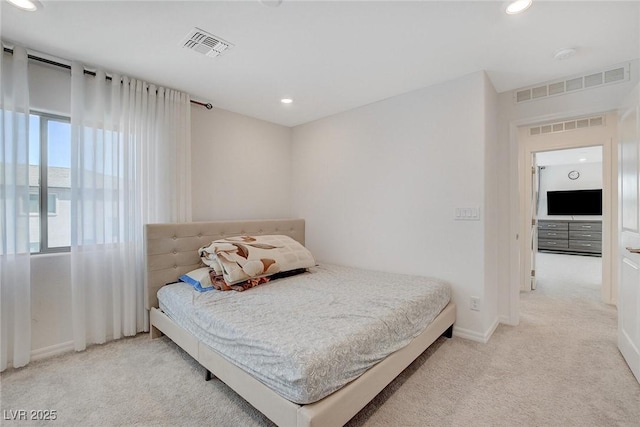 bedroom featuring light colored carpet