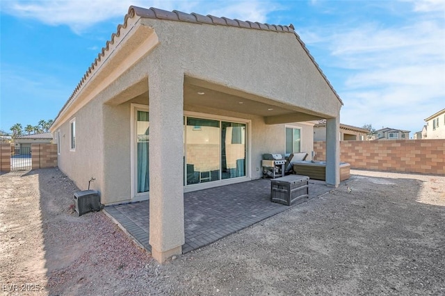 rear view of property with a patio