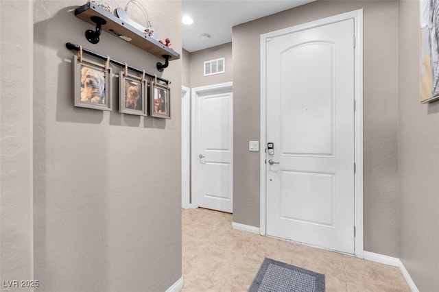 interior space with light tile patterned floors