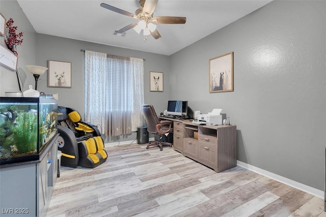 home office featuring ceiling fan and light hardwood / wood-style flooring