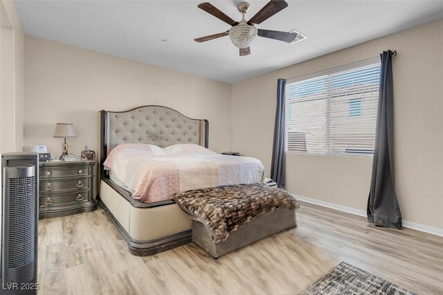 bedroom featuring light hardwood / wood-style floors and ceiling fan