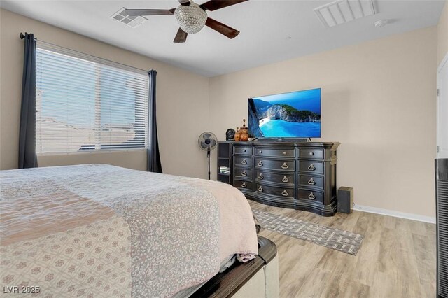 bedroom with hardwood / wood-style flooring and ceiling fan