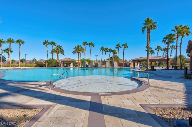 view of swimming pool with a patio area and a gazebo