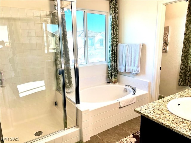 bathroom with vanity, independent shower and bath, and tile patterned flooring