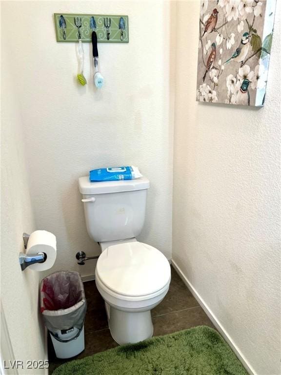 bathroom with tile patterned floors and toilet