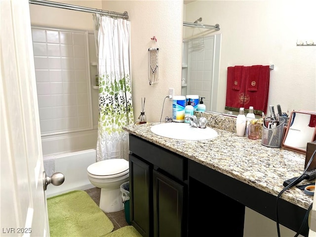 full bathroom with vanity, toilet, and shower / tub combo