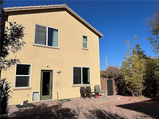 back of house featuring a patio