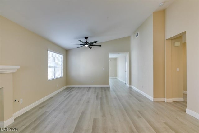 unfurnished living room featuring light hardwood / wood-style floors, ceiling fan, and vaulted ceiling