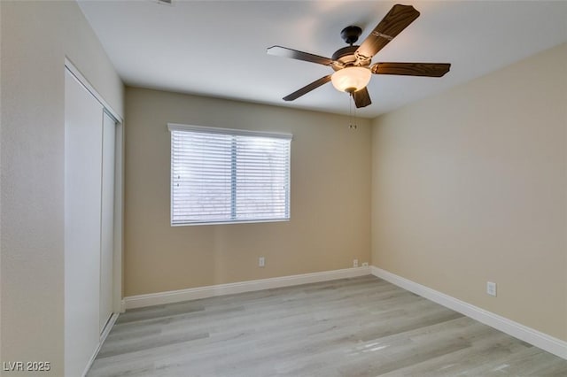 unfurnished room with ceiling fan and light hardwood / wood-style flooring