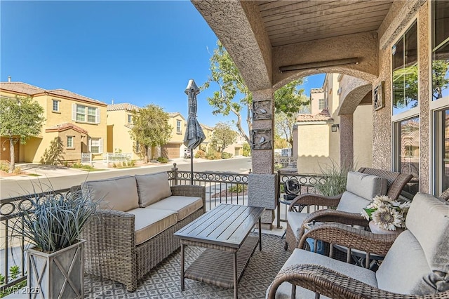 view of patio / terrace with a balcony and outdoor lounge area