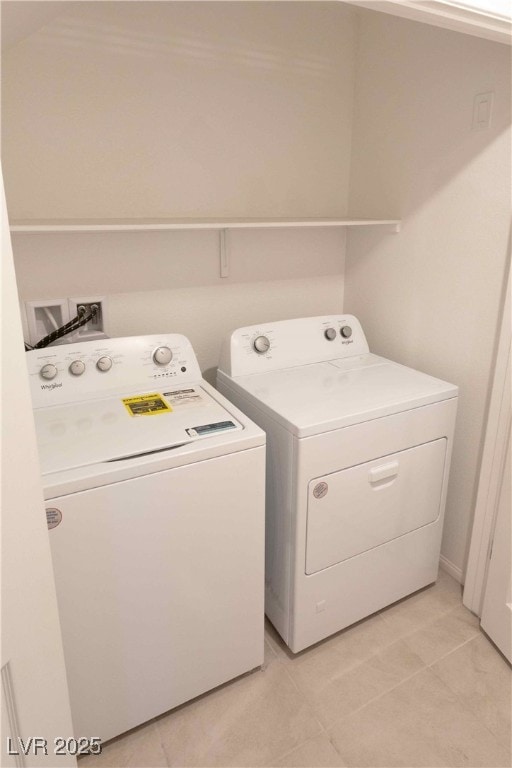 washroom with washing machine and dryer