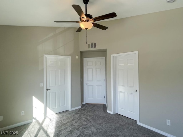 unfurnished bedroom with dark carpet, high vaulted ceiling, and ceiling fan