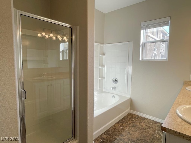 bathroom featuring independent shower and bath and vanity