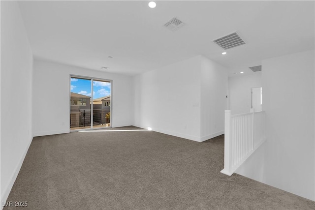 empty room featuring carpet flooring