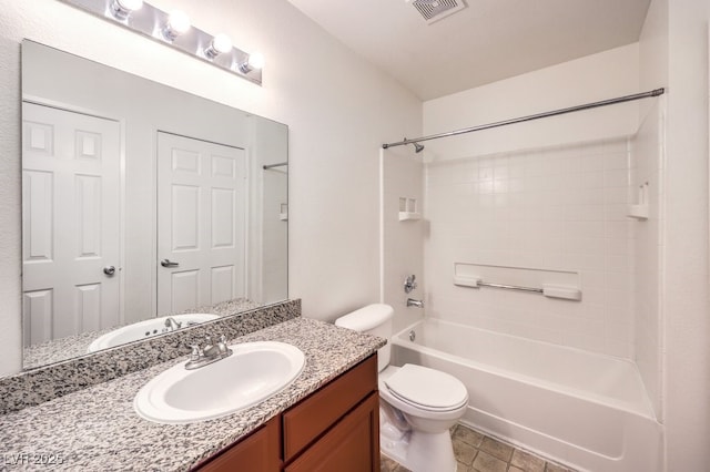 full bathroom featuring toilet, vanity, and bathing tub / shower combination