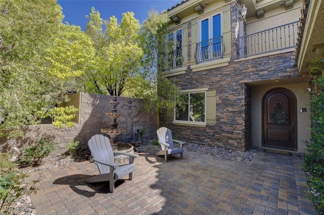 view of patio with a balcony