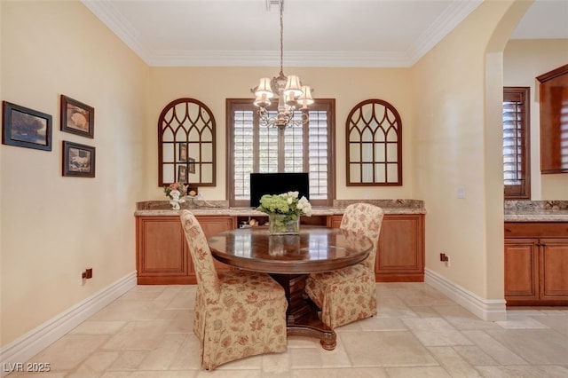 4450 Palisades Canyon Cir, Las Vegas, NV 89129 - dining area with arched walkways, a chandelier, baseboards, ornamental molding, and stone tile floors