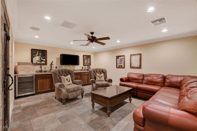 4450 Palisades Canyon Cir, Las Vegas, NV 89129 - living area featuring beverage cooler, bar with sink, a ceiling fan, recessed lighting, and baseboards