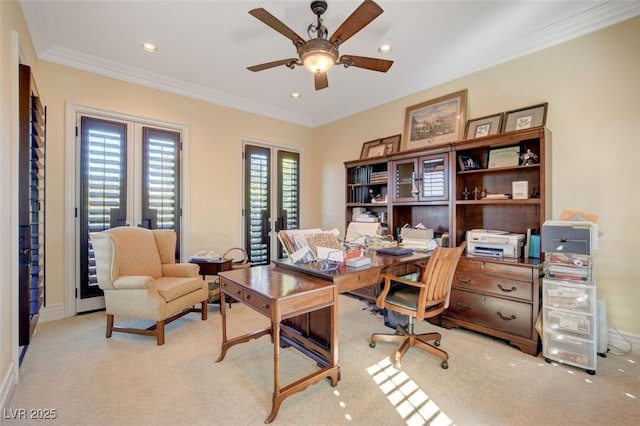 home office featuring light carpet, ceiling fan, ornamental molding, and baseboards