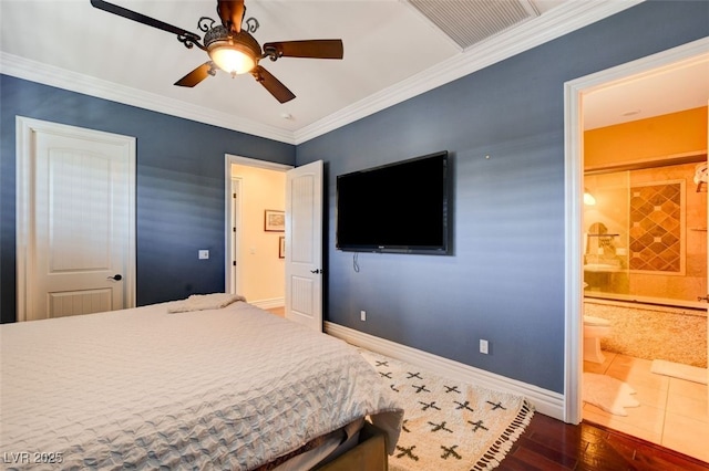 bedroom featuring ceiling fan, dark wood-type flooring, ornamental molding, and ensuite bath