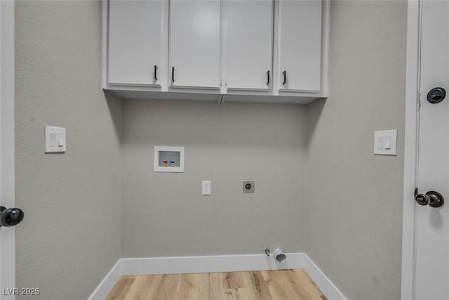 laundry area with electric dryer hookup, light wood-type flooring, hookup for a gas dryer, cabinets, and washer hookup