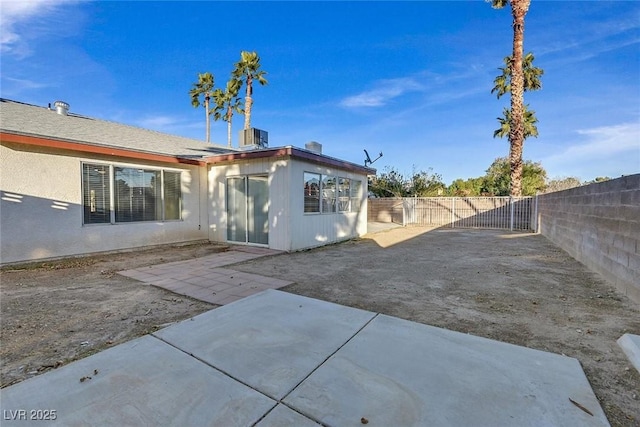 back of house with a patio