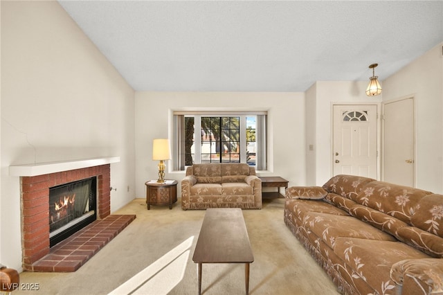 living room with a brick fireplace, a textured ceiling, and light carpet