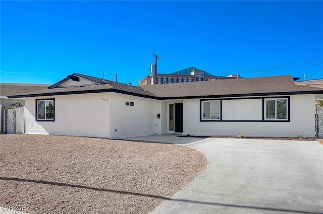 ranch-style home with a patio area