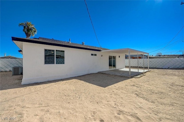 back of house with a patio and cooling unit