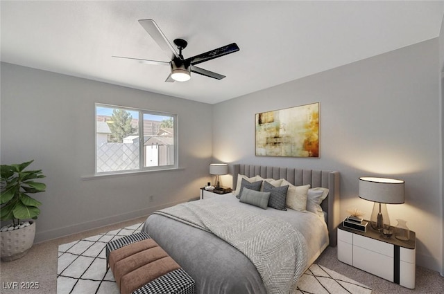 bedroom featuring ceiling fan and light colored carpet