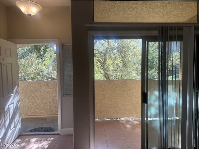 doorway featuring tile patterned flooring