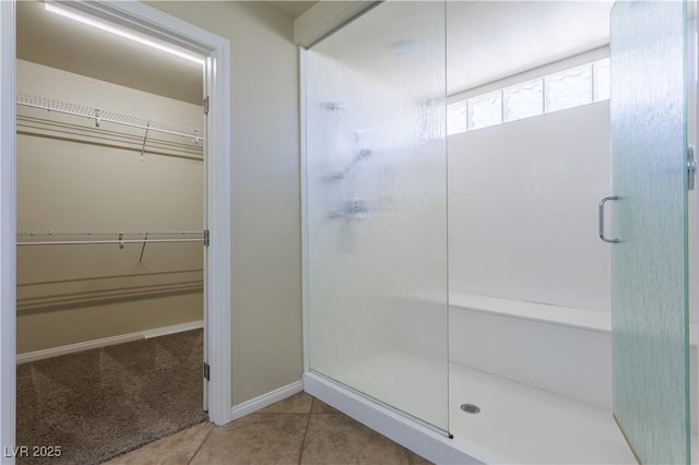 bathroom featuring tile patterned floors and an enclosed shower