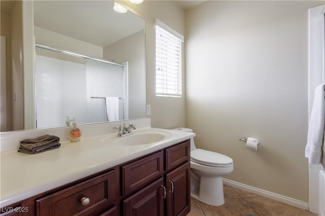 bathroom with an enclosed shower, vanity, tile patterned floors, and toilet