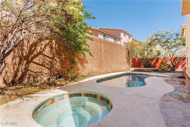 view of pool with an in ground hot tub