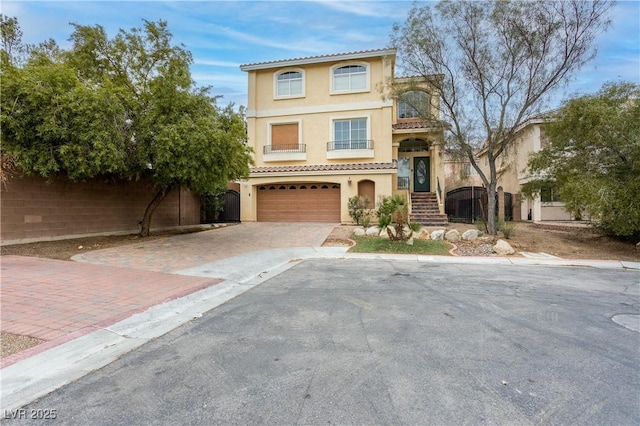 mediterranean / spanish-style house featuring a garage