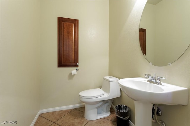 bathroom featuring tile patterned flooring and toilet