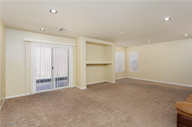 unfurnished living room with carpet floors