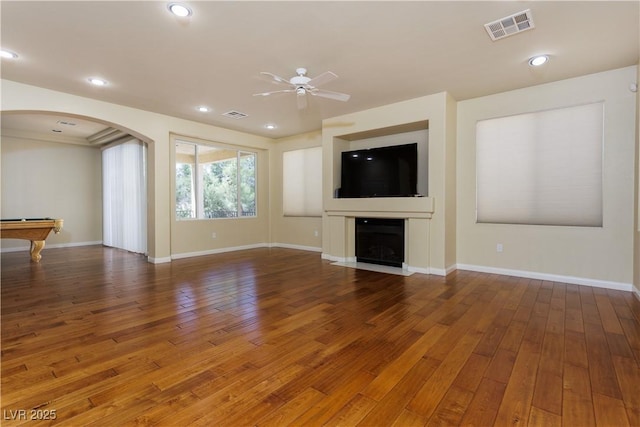 unfurnished living room with pool table, dark hardwood / wood-style floors, and ceiling fan