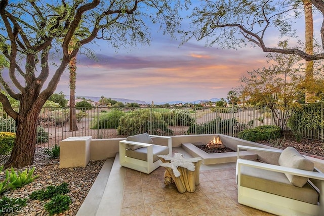 patio terrace at dusk with a fire pit