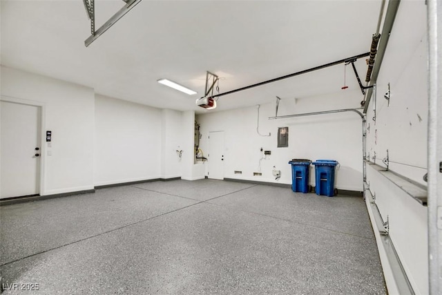 garage featuring electric panel and a garage door opener