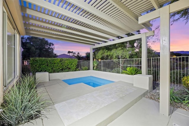 pool at dusk featuring an in ground hot tub, a patio, and a pergola