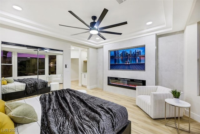 bedroom featuring ceiling fan and light hardwood / wood-style floors