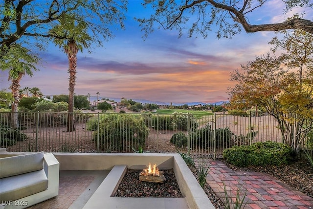 patio terrace at dusk with a fire pit