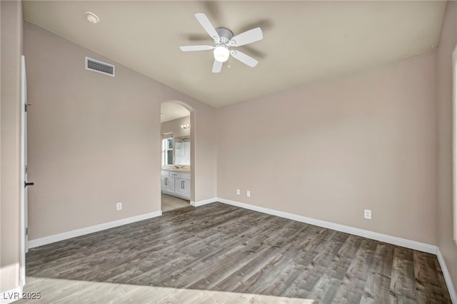 unfurnished room featuring hardwood / wood-style floors and ceiling fan